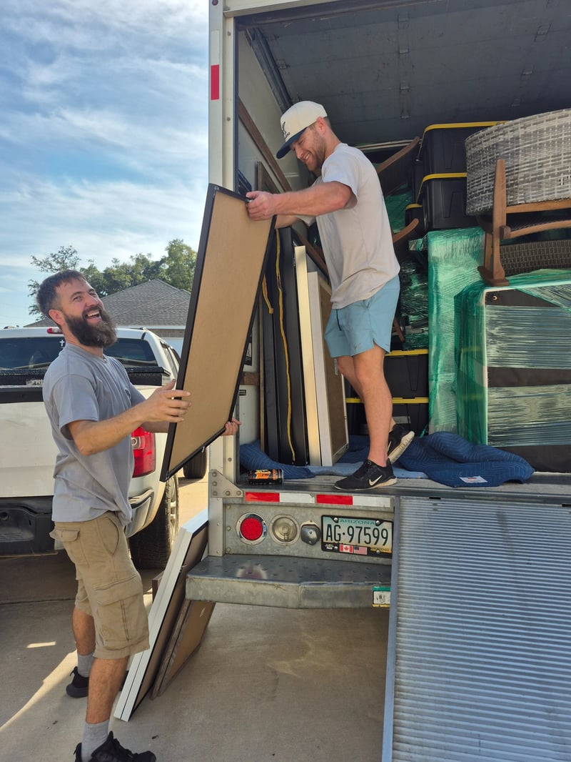 Way Maker Movers team Carson and Steve moving furniture